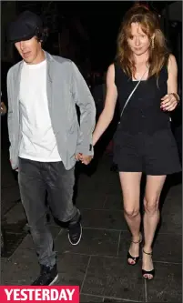  ??  ?? YESTERDAY Hand in hand: The star outside the Cirque Le Soir in London with the mystery redhead