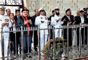  ?? APP ?? Federal Railways Minister Sheikh Rashid Ahmad offering Fateha after laying a floral wreath at the mausoleum of the Quaid-e-Azam Mohammed Ali Jinnah in Karachi on Tuesday. —