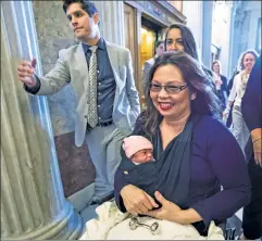  ??  ?? Leaning in: Sen. Tammy Duckworth and daughter Maile at the Capitol.