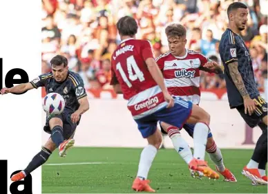  ?? — AFP ?? Having a blast: Real Madrid’s Brahim diaz takes a shot at the Granada goal.