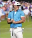  ?? Mark Humphrey Associated Press ?? BROOKS KOEPKA watches as his birdie-putt attempt misses the hole on the 18th green Sunday.