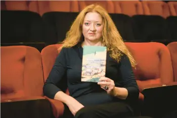  ?? DANIEL LEAL/GETTY-AFP ?? Claire Keegan, seen Oct. 14, holds her novella shortliste­d for the Booker Prize,“Small Things Like These.”