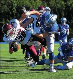  ?? BILL RUDICK — DIGITAL FIRST MEDIA ?? Great Valley’s Ryan Hubley knocks down Oxford running back Brandon Holz short of the goalline Saturday.