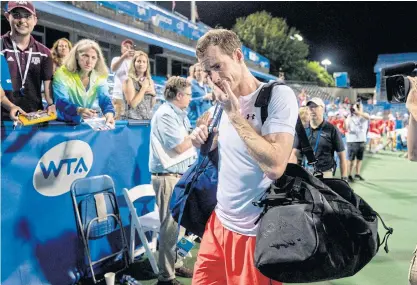  ??  ?? An emotional Andy Murray steps off court after defeating Marius Copil in Washington.