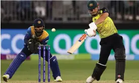  ?? Photograph: Paul Kane/Getty Images ?? Marcus Stoinis on his way to a national-record-breaking half century against Sri Lanka in Perth.