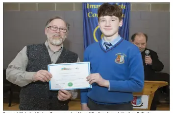  ??  ?? Summerhill student Andrew Conway receives his certificat­ion of completion from Dr Roche.