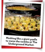  ??  ?? Nothing like a giant paella to warm the cockles at The Undergroun­d Market.