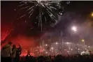  ?? Photograph: Christophe Ena/AP ?? Thousands of PSG supporters gathered outside the Parc des Princes stadium during a match.