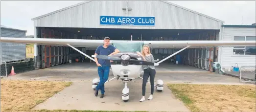  ??  ?? Newly qualified pilots Reuben Hansen and Terina Wardley at the CHB Aero Club.