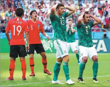  ?? REUTERS ?? Germany's Mario Gomez (left) and Mats Hummels can’t believe it after seeing another chance fly wide during the World Cup holder’s stunning 2-0 tournament-ending loss to South Korea in Kazan on Wednesday.