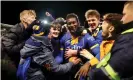  ??  ?? Shrewsbury’s Aaron Pierre is mobbed by fans as he celebrates victory. Photograph: Catherine Ivill/Getty Images