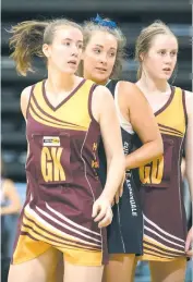  ??  ?? Left: Drouin’s Kym Diston and April Bethune defended tightly; Photograph­s: Grant Treeby, treebyimag­es.com.au.