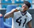  ?? BOB SELF/FLORIDA TIMES-UNION ?? Josh Allen takes a water break during a Jaguars organized team activity session at TIAA Bank Field on May 23, 2022.