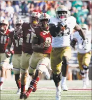  ?? Michael Dwyer / Associated Press ?? Notre Dame’s Josh Adams (33) breaks away from Boston College’s Will Harris (8) during the first half in Boston.