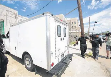  ?? Dan Anderson EPA ?? ORLEANS PARISH sheriff’s deputies hold back the media as a van carrying Robert Durst leaves court Thursday. Durst has waived extraditio­n to California, but Louisiana is pursuing state charges.