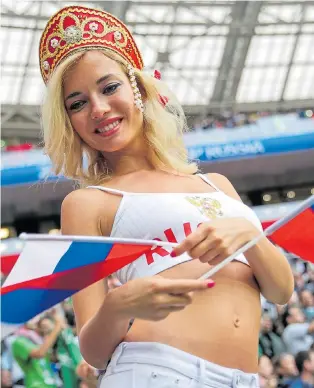  ??  ?? Flag day... thousands of Russian fans cheered their team to a resounding success