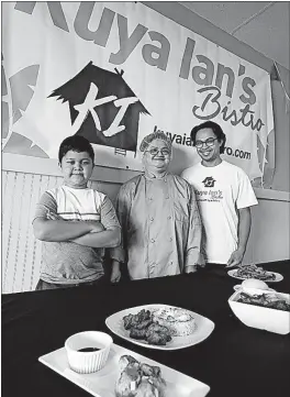  ?? [FRED SQUILLANTE/DISPATCH] ?? Ian Firmalan, 10, has his name in his family’s restaurant, Kuya Ian’s Bistro. His grandmothe­r Nonie Firmalan is chef and part owner, and his uncle Roebuck Firmalan is also part owner.