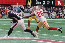  ?? AP PHOTO/BRYNN ANDERSON ?? Atlanta Falcons tight end Kyle Pitts (8) makes a catch for a touchdown against San Francisco 49ers cornerback Samuel Womack III during the second half of Sunday's game in Atlanta.