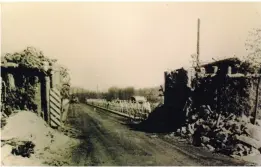  ?? ?? ■ The scale of the barricade which blocked the way across the bridge is clear in this photograph taken after the tanks smashed their way through to open the road to Lingen.