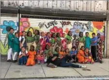  ?? LORETTA RODGERS - DIGITAL FIRST MEDIA ?? Members of the Matsiko World Orphan Choir pose after their performanc­e Sunday afternoon at the MJ Freed Theater with Devon Walls, founder of the Artist Warehouse in Chester.