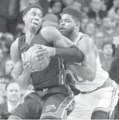  ?? ELISE AMENDOLA/AP ?? Heat center Hassan Whiteside, left, makes a move against Celtics forward Amir Johnson in Boston on Friday.