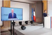 ?? BENOIT TESSIER/ ASSOCIATED PRESS ?? French President Emmanuel Macron, right, attends a videoconfe­rence meeting as U.S. President Joe Biden appears on a screen ahead of a Munich Security Conference in Paris on Feb. 19, 2021.