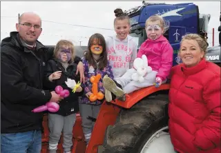  ??  ?? John,Caoimhe and Aoibhinn Dee, Cassie,Tia and Tina O’Sullivan getting up close to some of the exciting machinery on display in Banna on Easter Sunday.