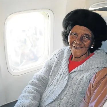  ??  ?? IN SEVENTH HEAVEN: Emily Sakulwa enjoys her first flight, at the age of 100