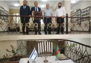  ?? (Economic Peace Center) ?? LEFT TO RIGHT: Head of Georgian Jewish Community Rabbi Zamir Isayev, the writer, head of Mountain Jewish Community Milikh Yevdayev, and another member of the Azerbaijan­i Jewish community visit a Baku synagogue last summer.