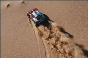  ?? (AFP) ?? Mini’s Spanish driver Carlos Sainz of Spain and co-driver Lucas Cruz of Spain wn the crucial 10th stage and increased their overall lead in the Dakar Rally 2020 on Wednesday.