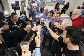  ?? Images ?? Scientists celebrate as the lander touches down on the moon. Photograph: David Swanson/NASA/AFP/Getty