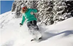  ?? Jeremy Swanson / Courtesy photo ?? A skier tackles 14 inches of fresh powder at Aspen Snowmass.