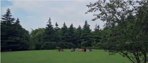  ?? ?? A group of young people practice yoga on grassland at Nanjingyua­n Park.