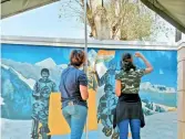  ?? — DC ?? Students paint pictures of army valour on the walls of AOC Centre in Secunderab­ad on Sunday.