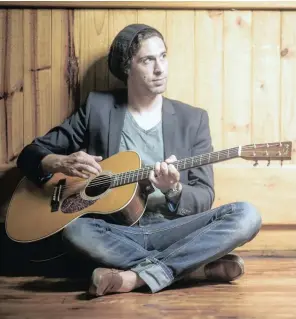  ?? PICTURE:CHARL PRETORIUS ?? Dan Patlansky strumming a guitar, is set to perform shows across KZN to promote his latest album, Introverig­o.