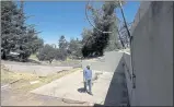  ?? JEFF CHIU — THE ASSOCIATED PRESS ?? Will Abrams walks on the lot of his family home in Santa Rosa on Thursday. It was destroyed by fire in 2017.