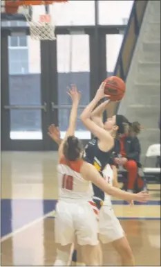  ?? STAFF PHOTO BY TED BLACK ?? St. Mary’s College of Maryland women’s basketball player Rachel Manning goes up for a layup in the first quarter of last Saturday’s contest against Wells. Manning and the Seahawks gained command early and coasted to a 68-31 victory over the Express.