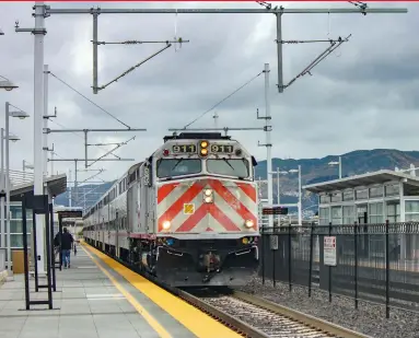  ?? Christophe­r Blaise ?? Caltrain F40PH-2CAT No. 911 leads train 236 into the San Bruno station in May 2019. This view is a link between the future, catenary supports installed, and the soon-to-be past, diesel motive power, on the peninsula. Locomotive 911 dates to April 1985.