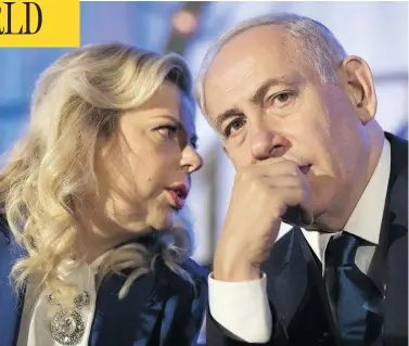  ?? ABIR SULTAN / AFP / GETTY IMAGES FILES ?? Israeli Prime Minister Benjamin Netanyahu and his wife Sara, who is accused of illegally claiming $132,000 for gourmet meals when a chef was already employed at taxpayer expense. They have repeatedly denied wrongdoing.