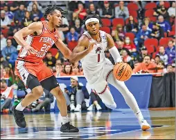  ?? CRAVEN WHITLOW/ Special to The Saline Courier ?? Razorback Ricky Council VI, 1, drives against a defender in a 73-63 win over Illinois Thursday in the first round of the NCAA Tournament in Des Moines, Iowa.