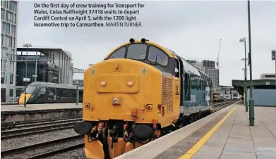  ?? MARTIN TURNER. ?? On the first day of crew training for Transport for Wales, Colas Railfreigh­t 37418 waits to depart Cardiff Central on April 5, with the 1200 light locomotive trip to Carmarthen.