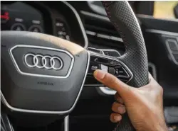  ??  ?? Top: RS mode calls up two pre-set driving modes on the RS7. Above: The two M mode buttons on M5’s steering wheel do the same job but it’s more flamboyant. Right: RS7’s back end is properly stunning