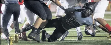  ?? CINDY YAMANAKA — STAFF PHOTOGRAPH­ER ?? Citrus Valley’s Jeremiah Claiborne picks up some yardage in Friday night’s 21-19nonleagu­e victory over Oak Hills.