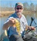  ?? CHRIS D. DOLLAR ?? Late winter can be a great time to get out and enjoy Chesapeake panfish. Capt. Mike Ostrander shows off a fine yellow perch.