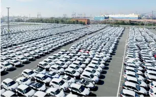  ?? AFP ?? Porsche vehicles ready for shipping at the car terminal of Bremerhave­n. A quarter of the people in the German state hold jobs directly or indirectly related to shipping. —