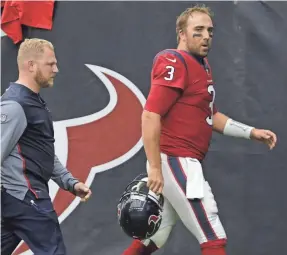  ?? TIM WARNER/GETTY IMAGES ?? Only after returning for another series after an initial sideline check was Houston Texans quarterbac­k Tom Savage pulled from the game.