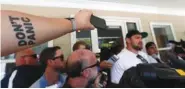  ??  ?? Atlanta Falcons offensive lineman Brandon Fusco speaks to reporters as he arrives for training camp last month in Flowery Branch, Ga. Fusco is among the contenders to start at right guard for the Falcons this season.