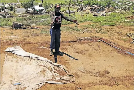  ?? / THULANI MBELE ?? Sipho Nhlapo points to where his shack used to be after it was abruptly blown away by a terrible storm that destroyed the whole informal settlement of Vaal Marina in Midvaal.