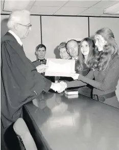  ??  ?? Gabor Simonyi and wife Etelka, left, receive Canadian citizenshi­p certificat­es in 1971. Also pictured are daughter, Etelka, and Carol Boyle, right.