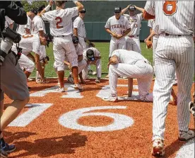  ?? STEPHEN SPILLMAN / FOR AUSTIN AMERICAN-STATESMAN ?? Texas players celebrate in center field after clinching their series with a 5-2win over TennesseeT­ech inAustinon­Monday.